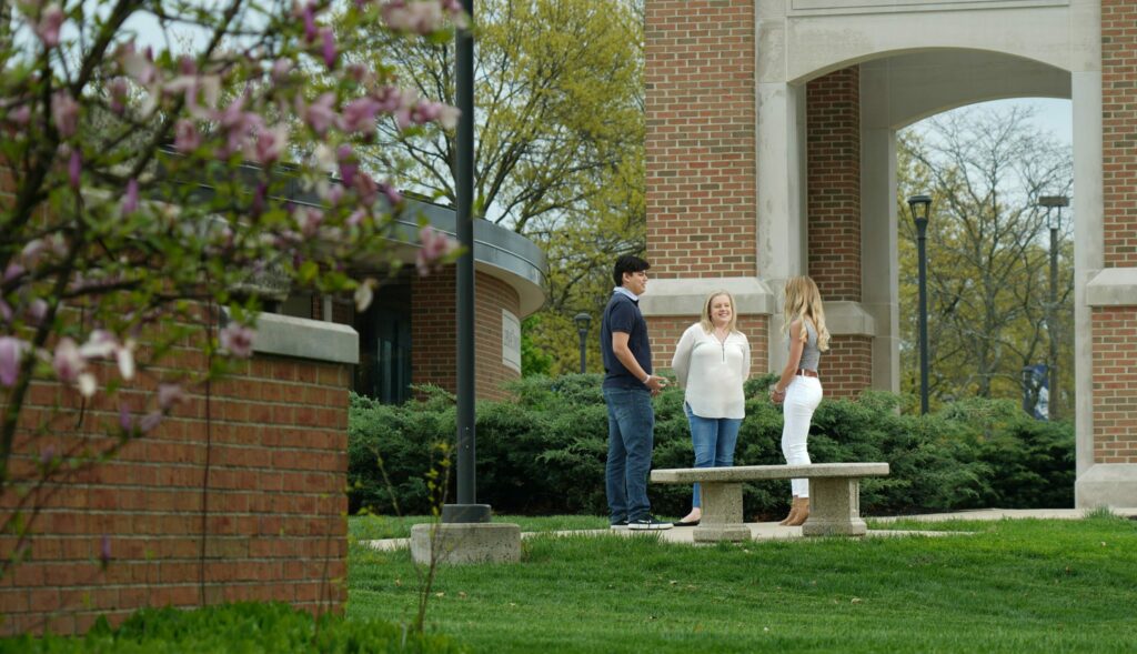 students standing outside chapel