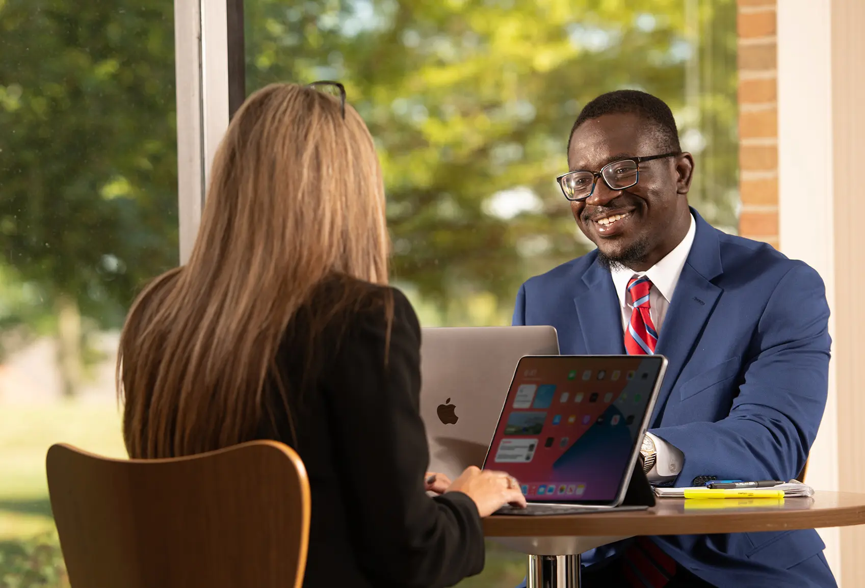 two adults in a meeting