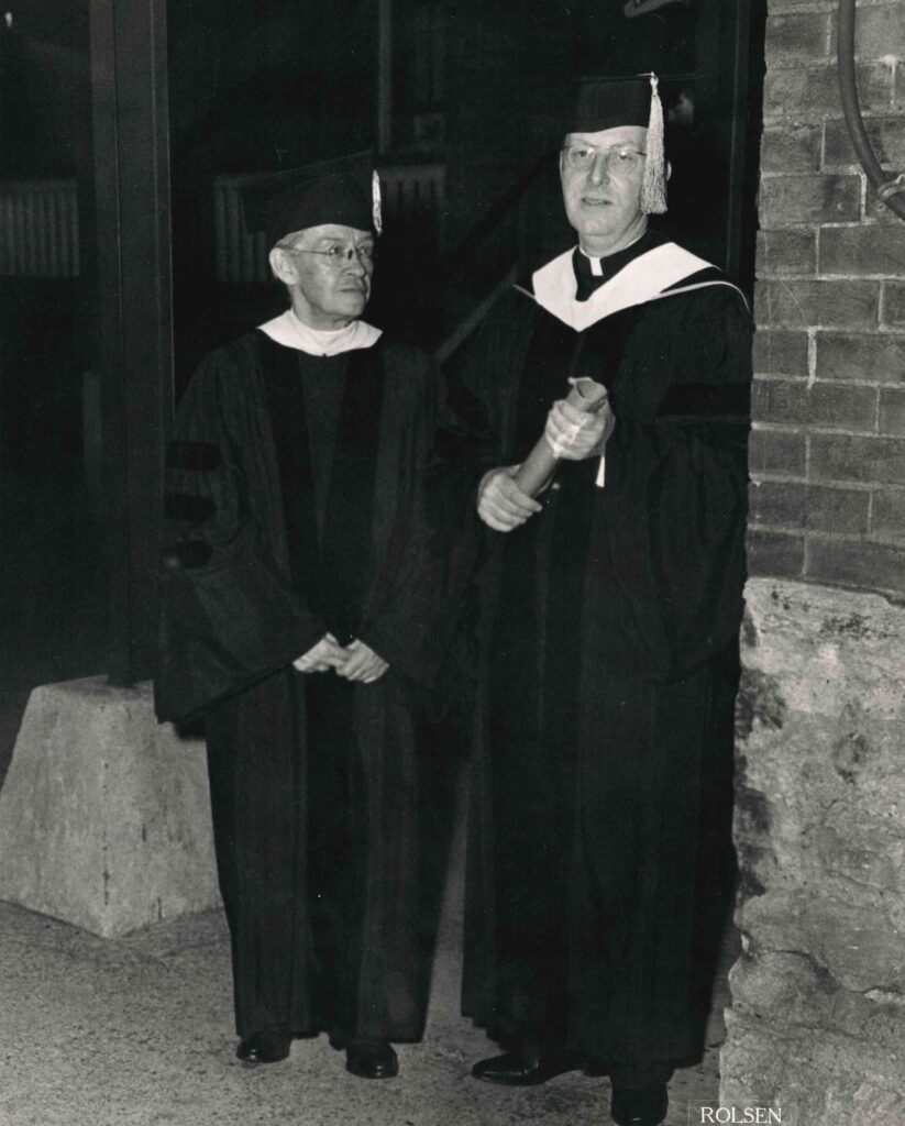 A photo of Rev. McCarty and a professor in Commencement regalia.