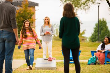 people playing game in yard