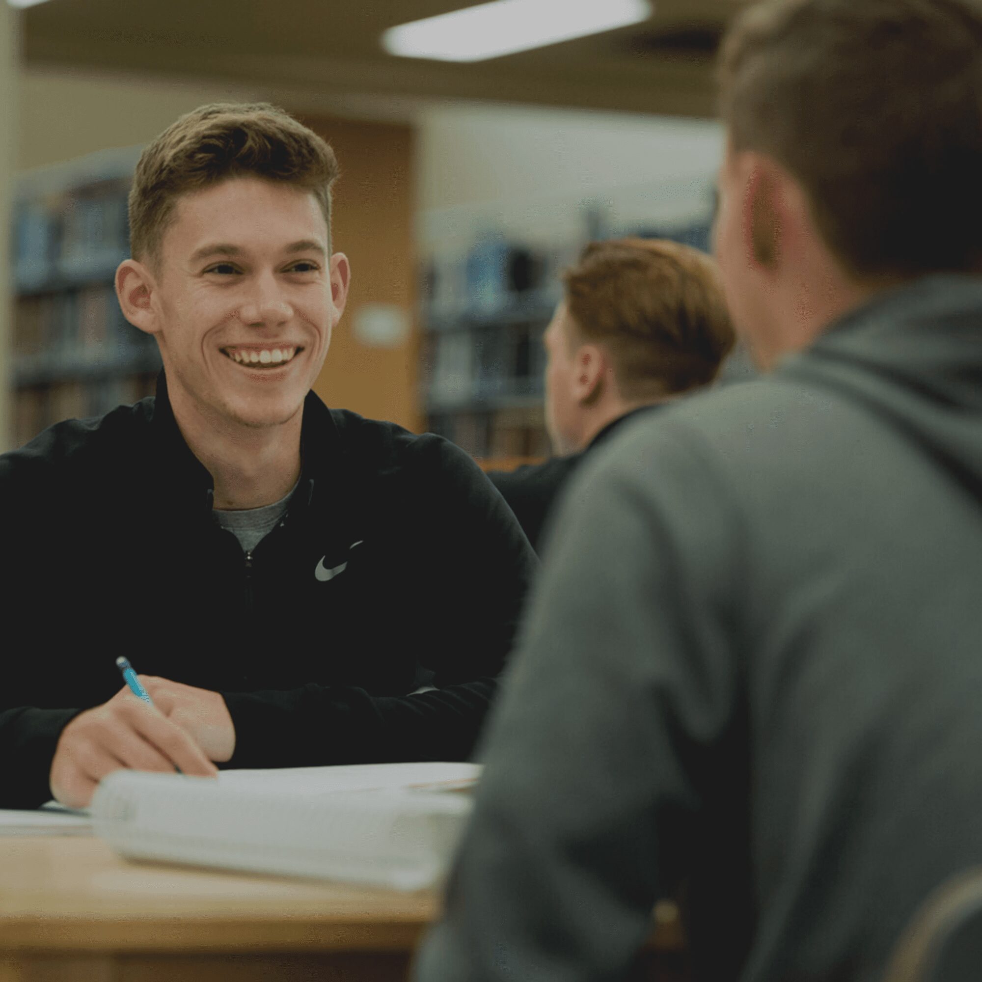 student studying in library