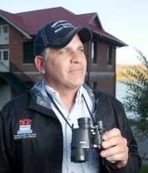 man holding binoculars